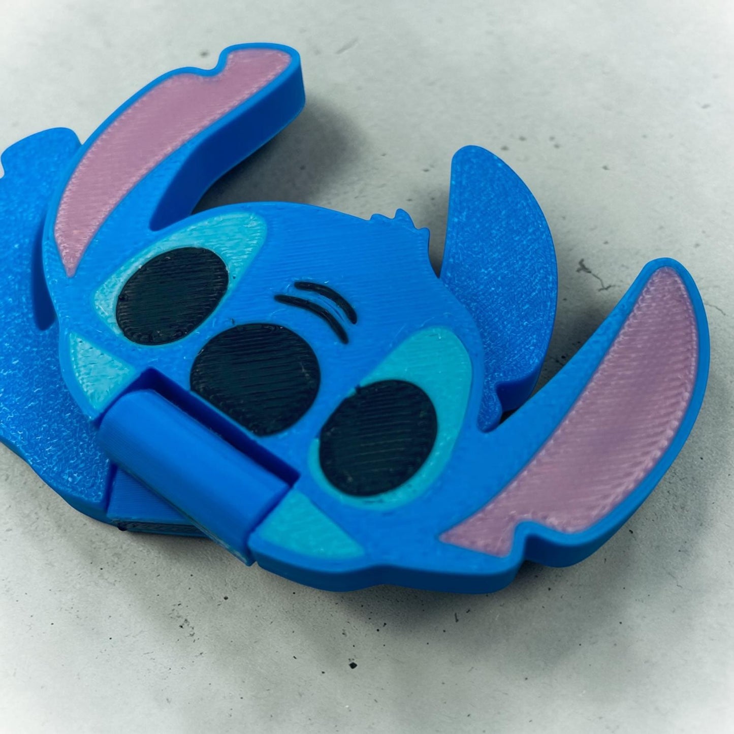 Slider Stitch anti-stress en impression 3D bleu, objet sensoriel geek à faire glisser entre les doigts
