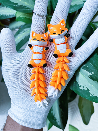 Porte-clé renard articulé 3D orange blanc et noir avec longue queue fluffy