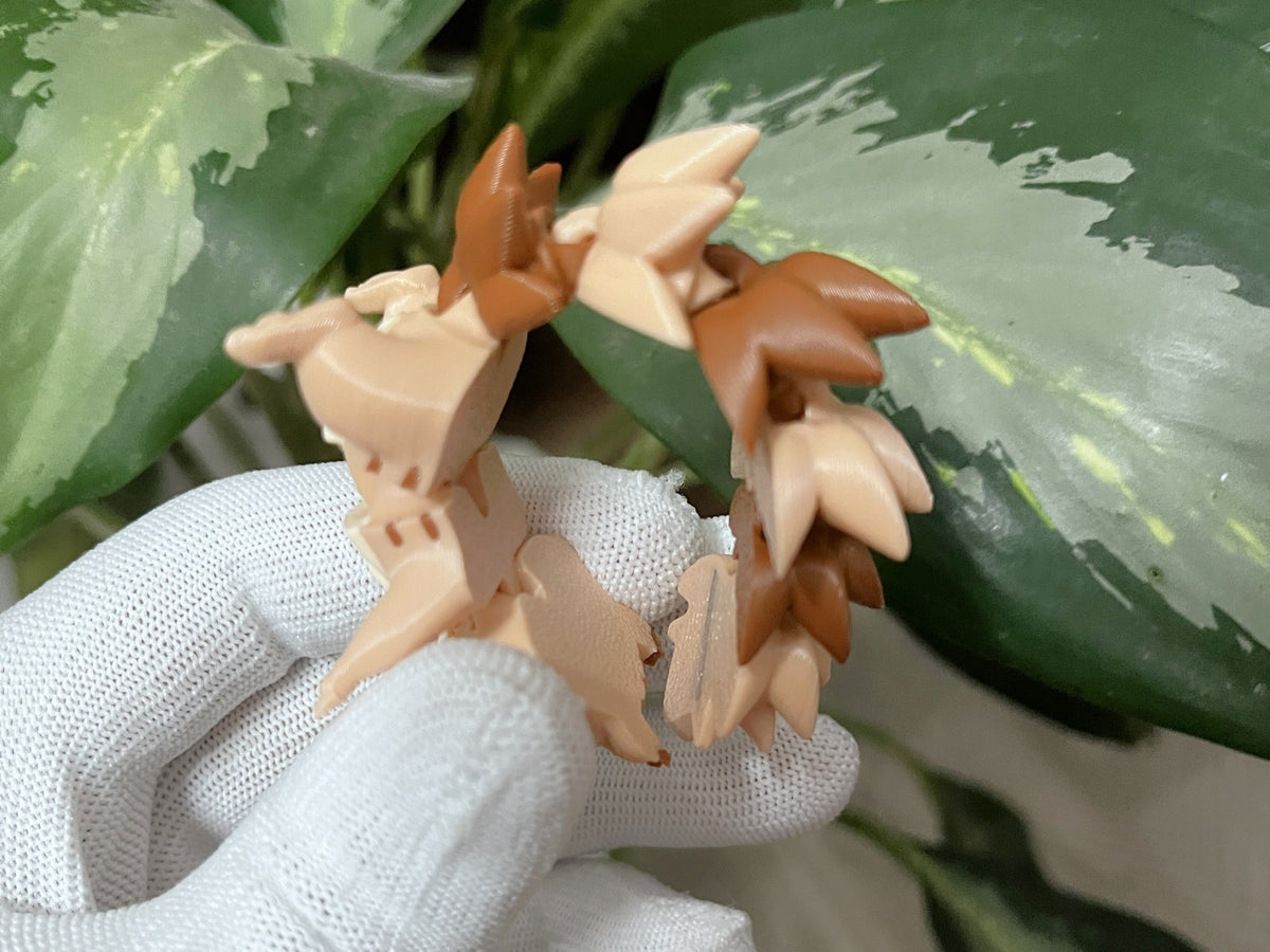 Détail de la queue flexible et articulée du porte-clés écureuil en impression 3D