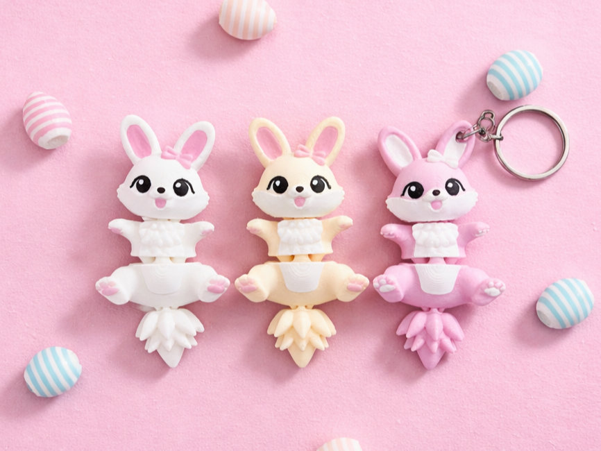 Lapins de Pâques kawaii articulés Fluffy Tails blanc crème et rose sur fond pastel
