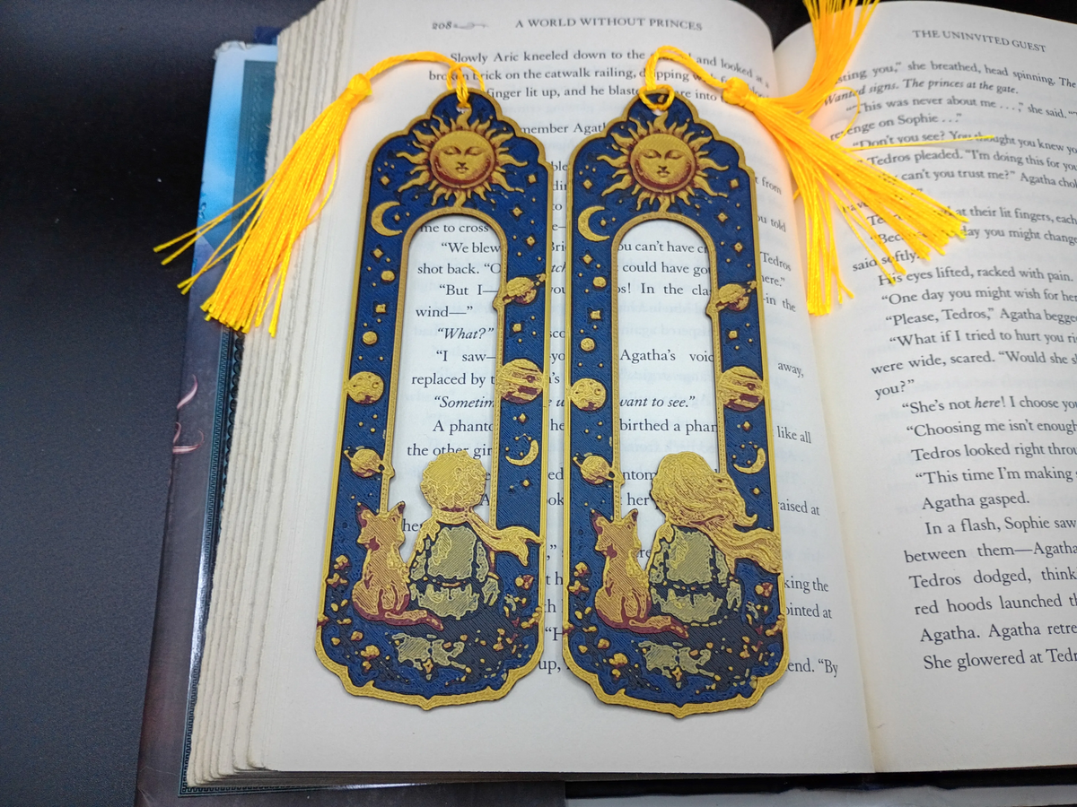 Marque-pages 3D Compagnons Cosmiques fille et garçon avec pompons jaunes