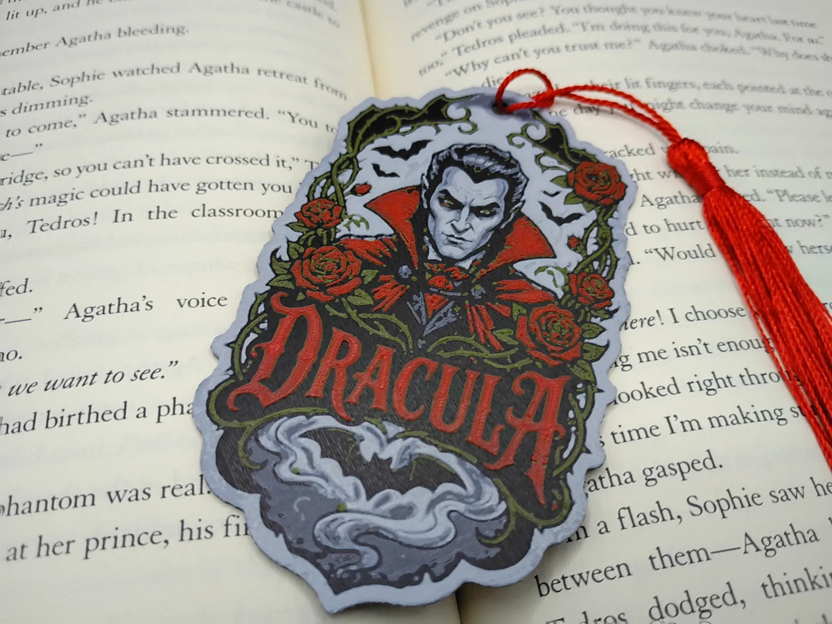 Marque-page gothique Dracula avec roses et chauves-souris dans un livre