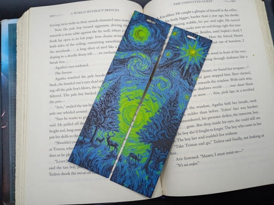Marque-pages 3D Forêt Étoilée bleu et vert sur un livre ouvert