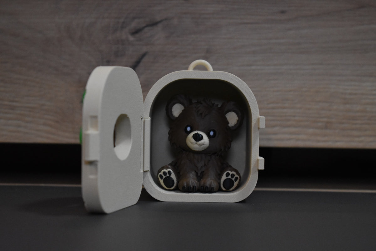 Pocket Pals Ours ouvert avec figurine amovible à l'intérieur