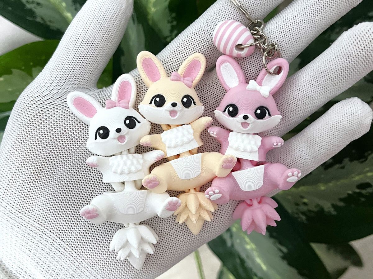 Porte-clé lapin de Pâques articulé Fluffy Tails en blanc crème et rose