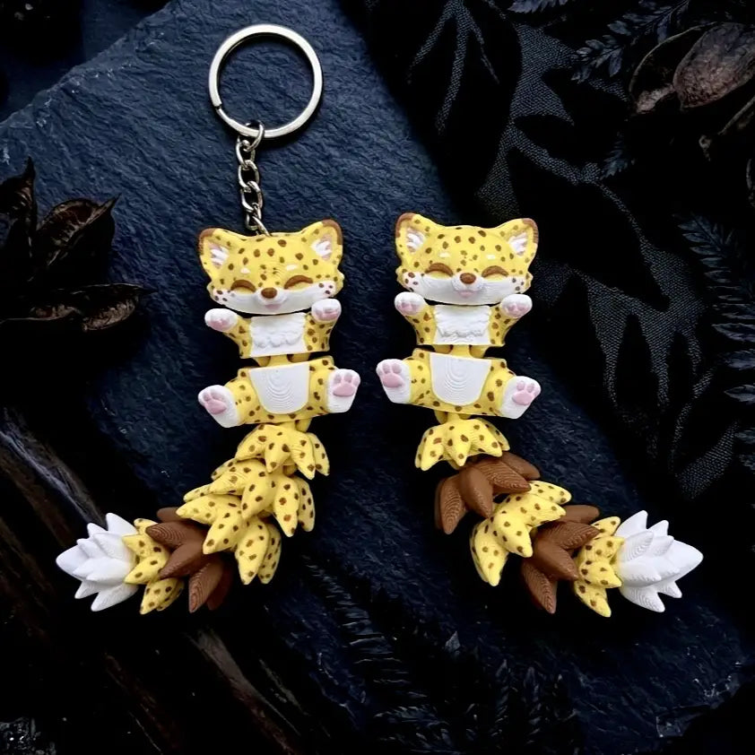 Porte-clés guépard articulé Flexi jaune et marron imprimé en 3D