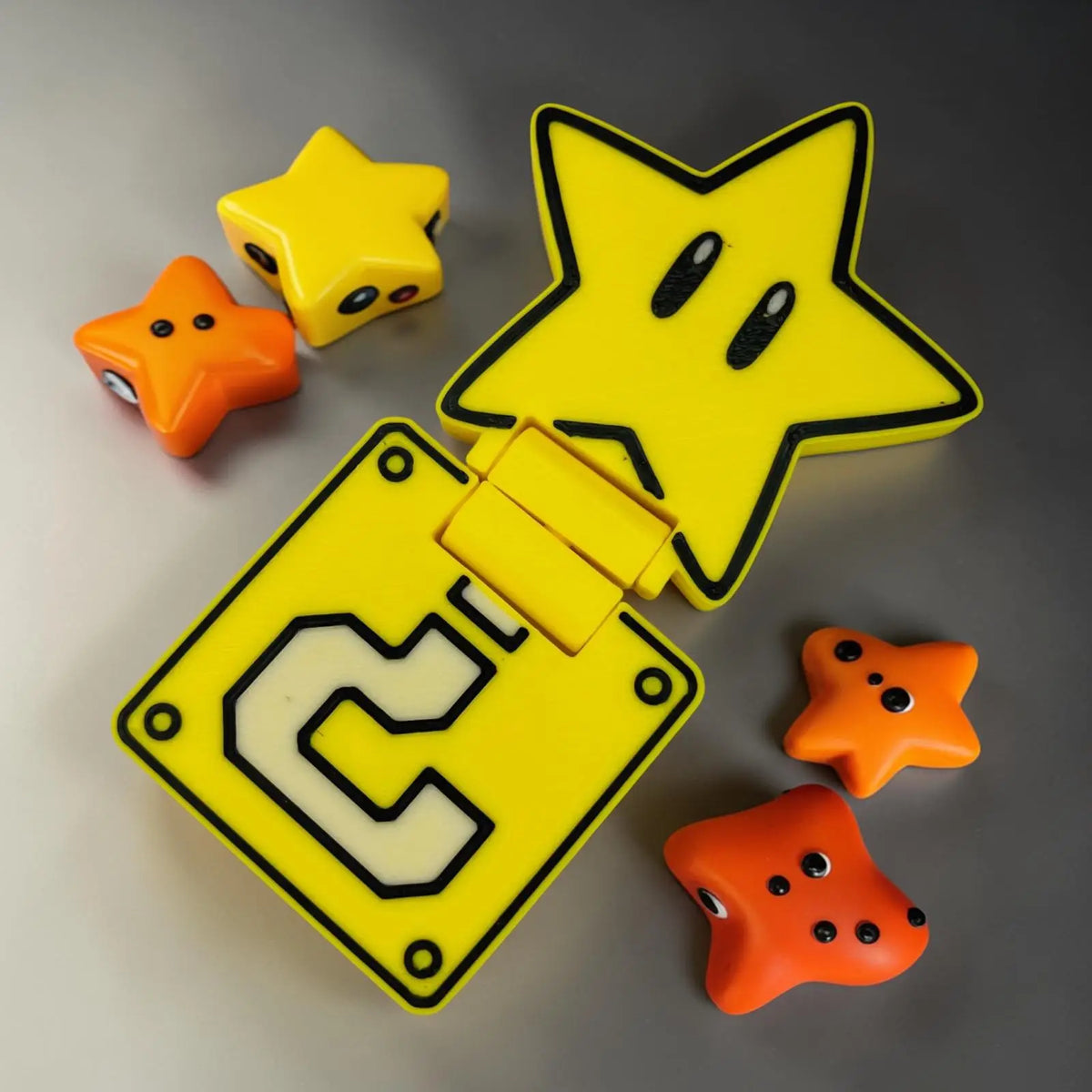 Slider étoile jaune style gaming en impression 3D avec mécanisme de glisse anti-stress