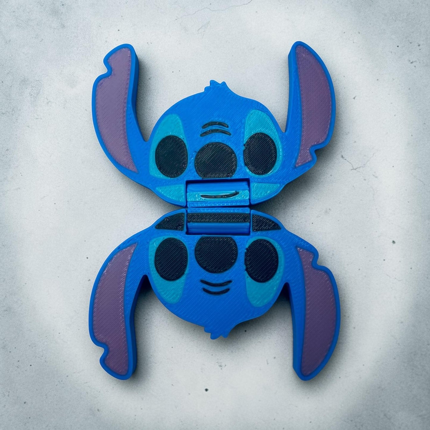 Slider Stitch anti-stress en impression 3D bleu, objet sensoriel geek à faire glisser entre les doigts